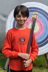 archery camper boy traditional summer camp new england