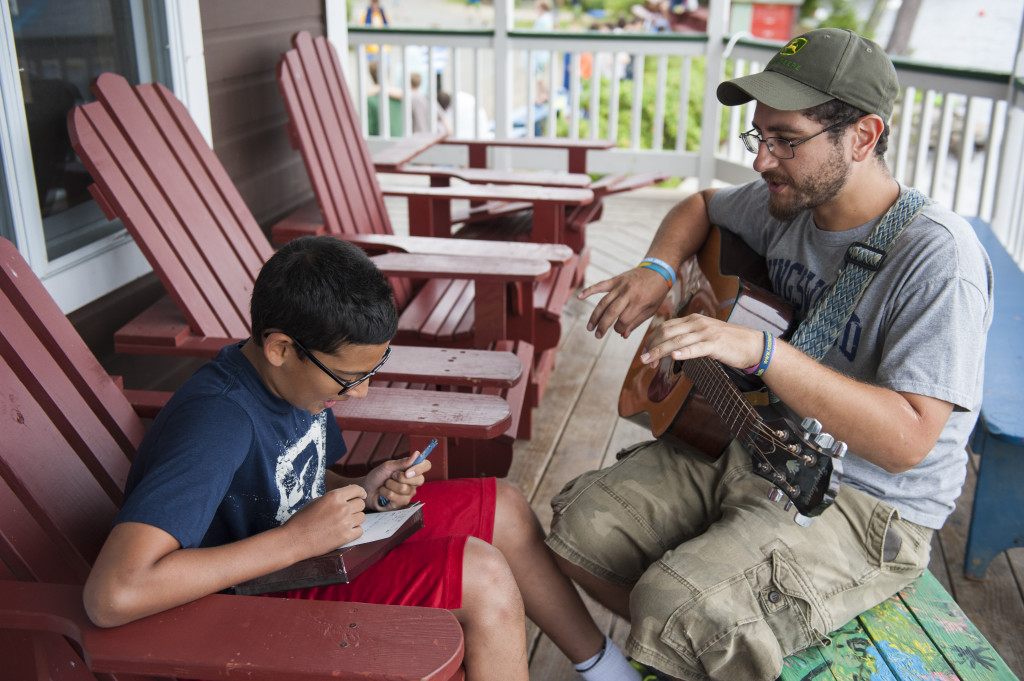 Music, of some sort, goes on all day long at Kingswood. This pic shows a song-writing activity in progress. Note the one-on-one. You see this a lot at Kingswood. 