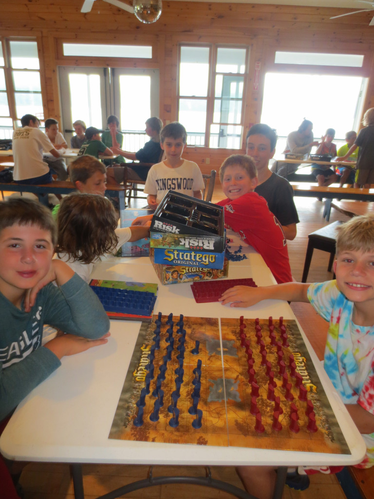 No electronics at Kingswood.  Head-to-head board games on rainy days are a camp staple.