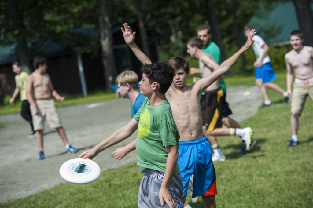 We have loads of Frisbee games.  The "hand up" defensive posture indicates an "Ultimate Frisbee" contest. 